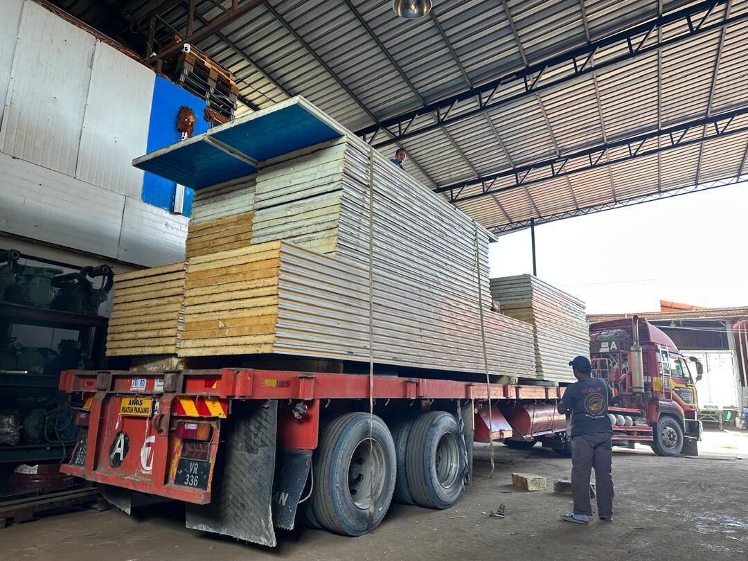 Stack of insulated panels loaded onto a lorry at the workshop